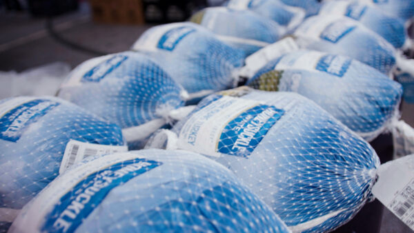 Turkeys laid out for families at the Atlanta Hawks Thanksgiving Pop-Up Grocery Market with UPS