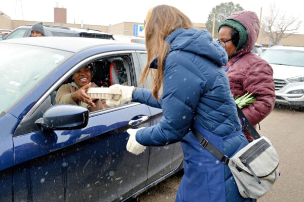 Modivcare corporate team member participating in holiday giving