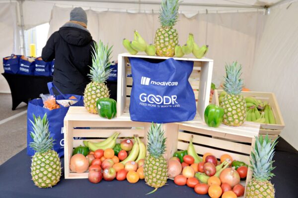Grocery and produce display at the Modivcare Holiday Pop-Up Grocery Market in Denver
