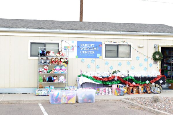A variety of toys and gifts for kids outside the Denver Modivcare holiday Pop-Up Grocery Market