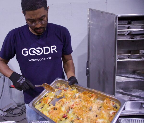 Goodr team member recovering food waste from a surplus food recovery partner