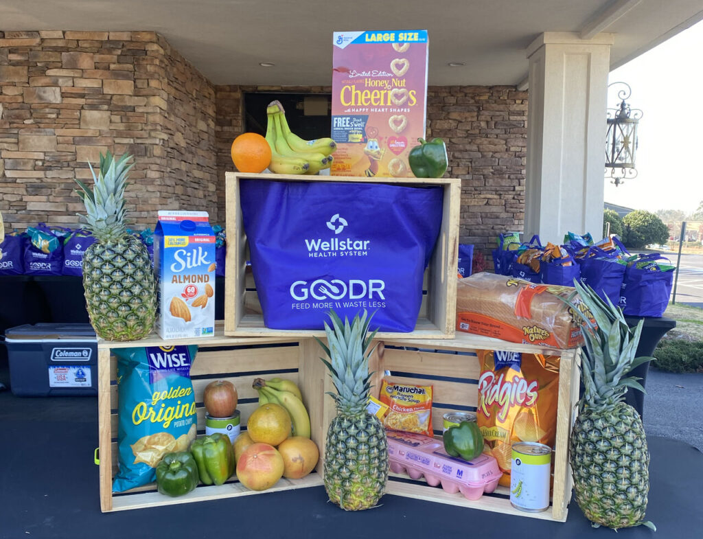 Grocery display table at the Wellstar and Goodr free pop-up grocery stores
